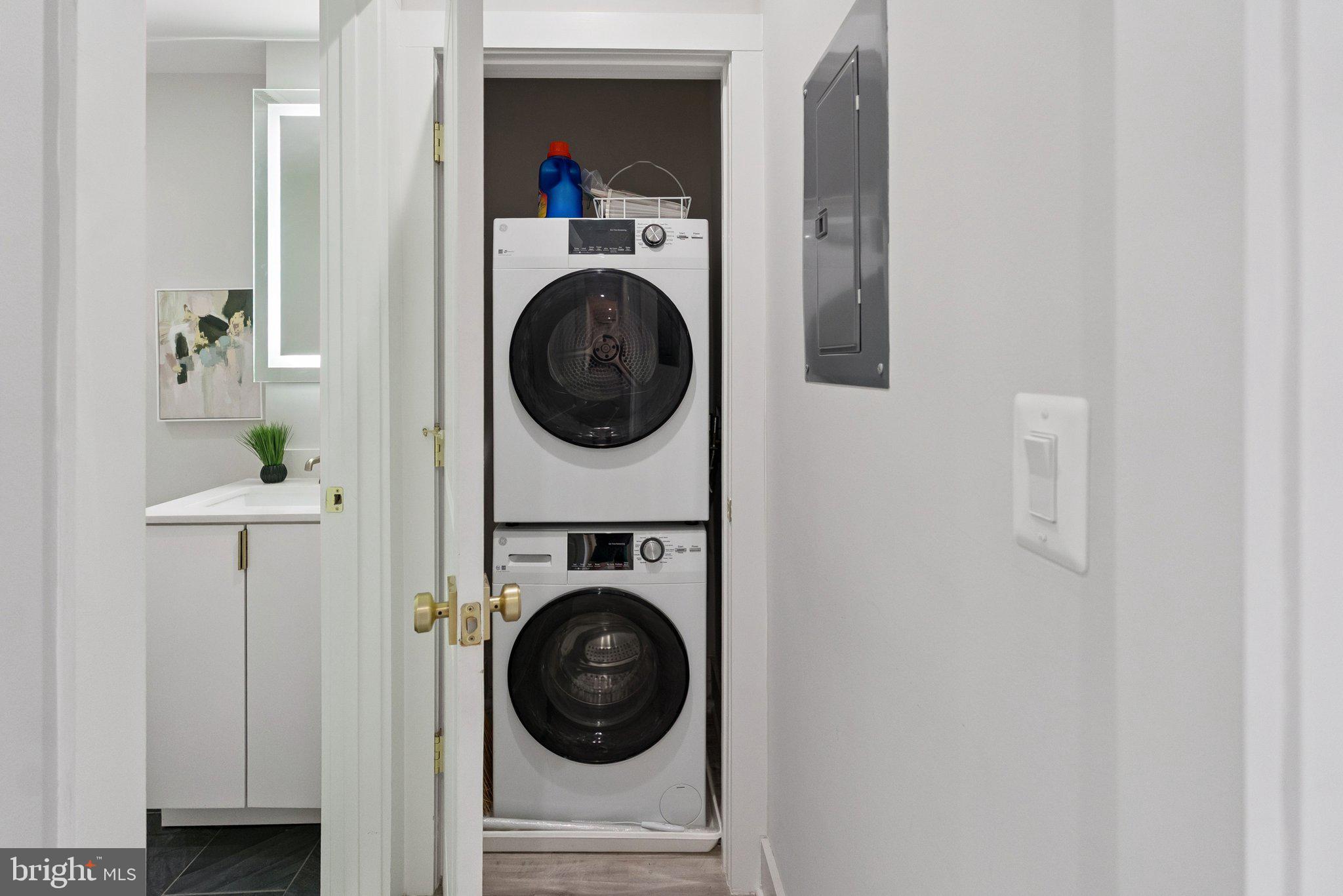 839 Kennedy Street Northwest, Unit 105 Washington, DC 20011 - Photo 10 of 21 a view of a hallway with washer and dryer