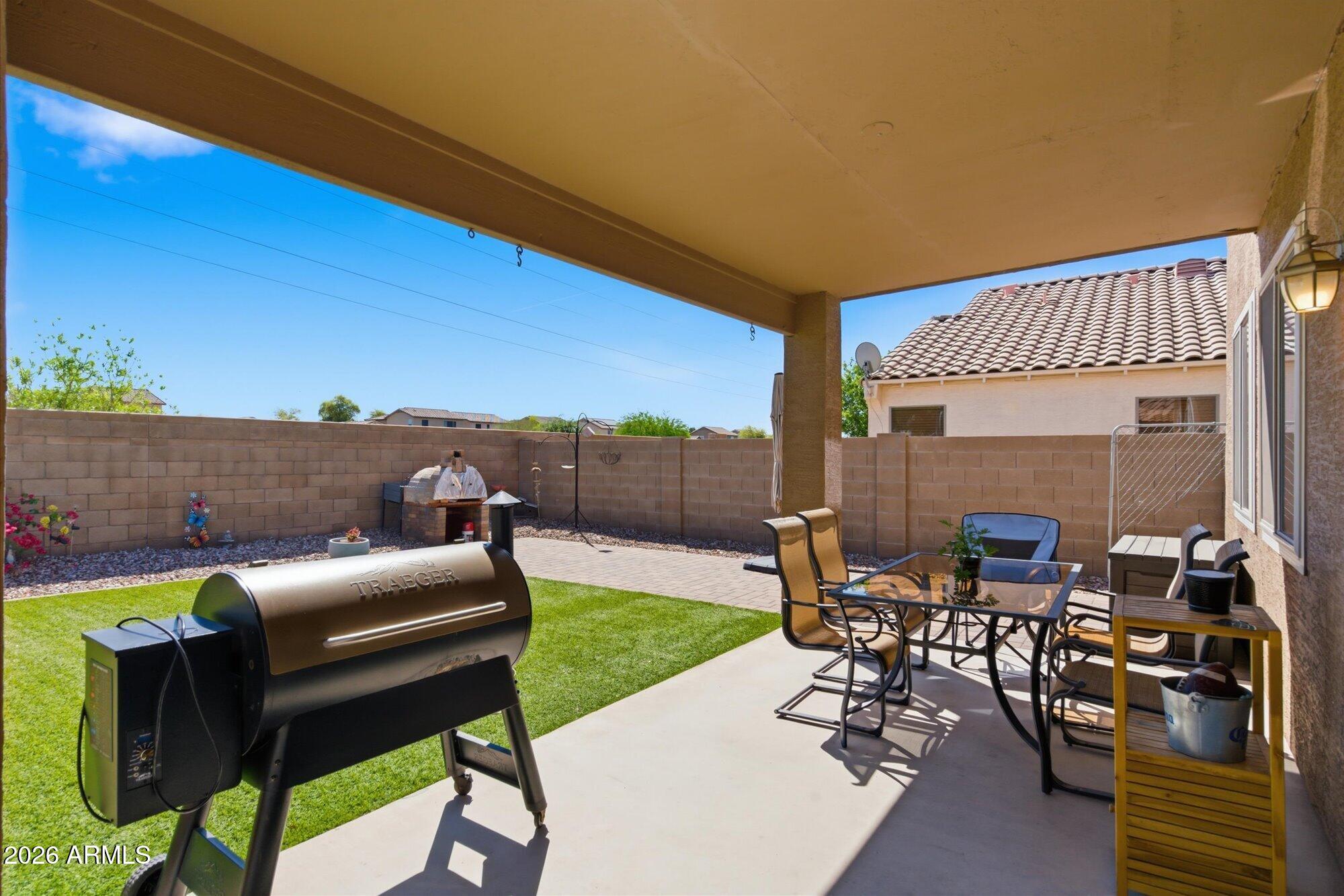 21915 Dietz Drive Maricopa, AZ 85138 - Photo 31 of 31 a view of a patio with couches table and chairs