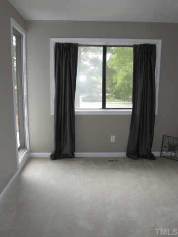 4282 Lake Ridge Drive Raleigh, NC 27604 - Photo 8 of 12 an empty room with windows