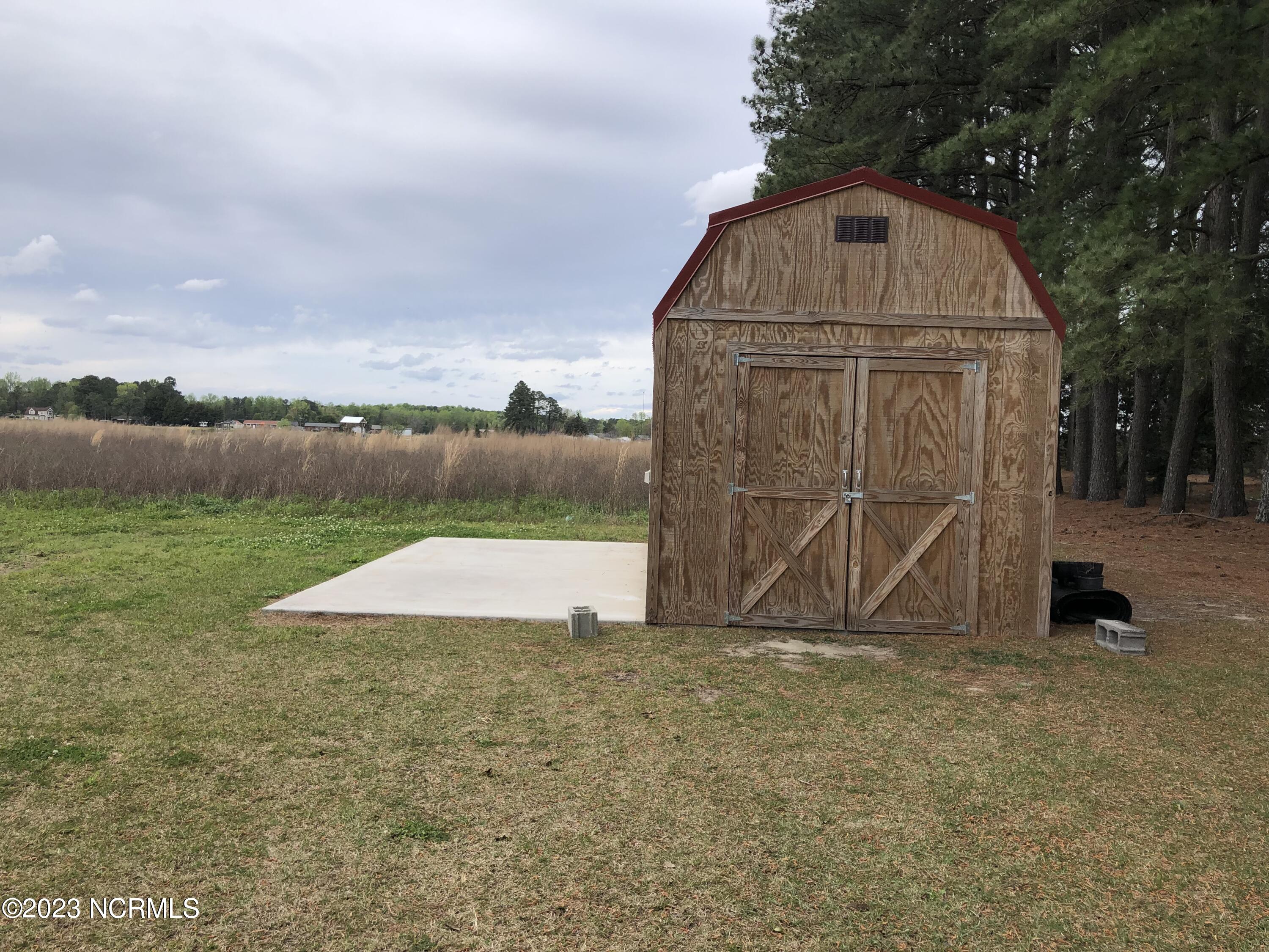 1890 Becton Farm Road Kinston, NC 28501 - Photo 27 of 30 Outside Building with concrete Pad