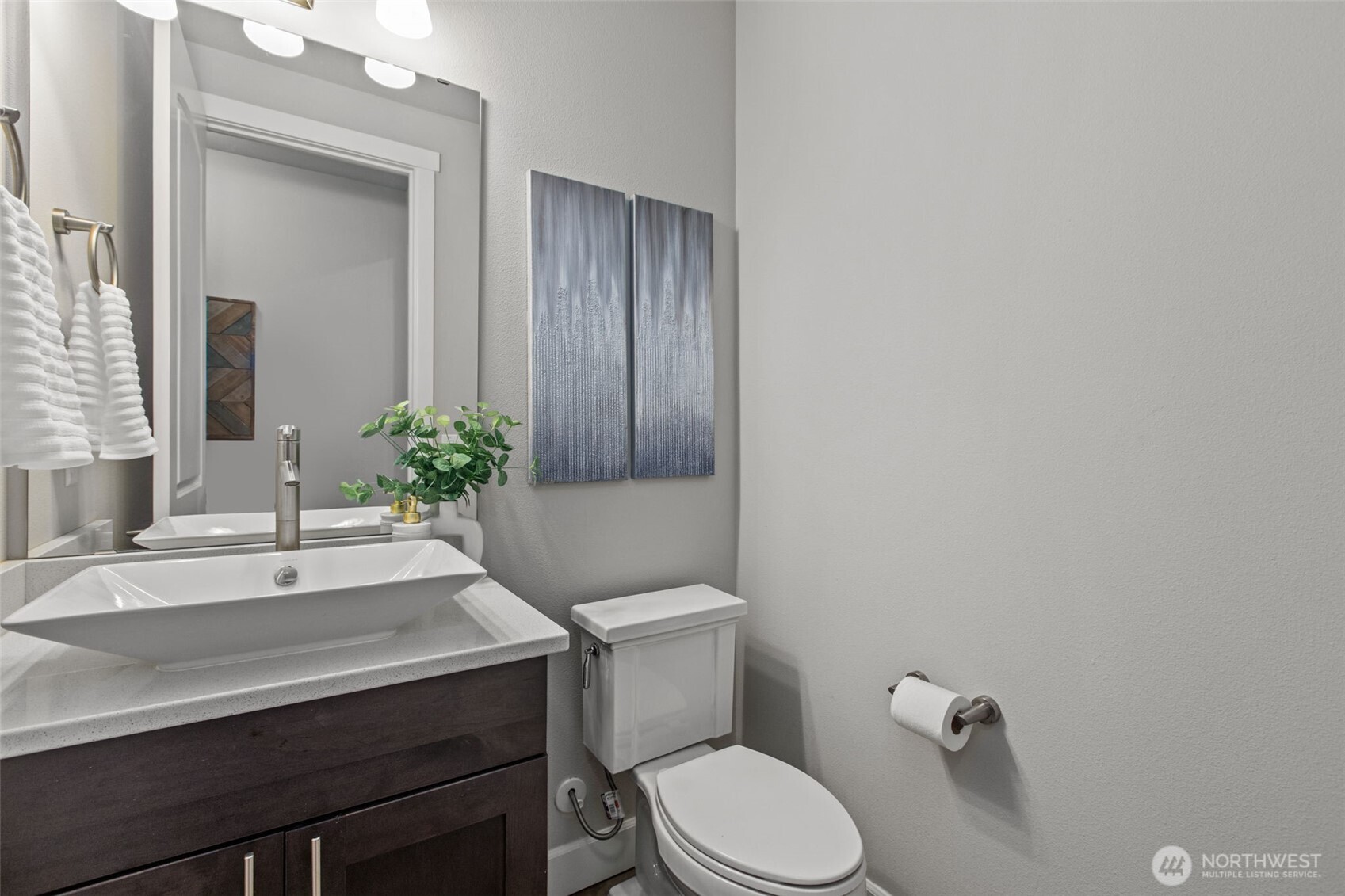 18231 3rd Drive Southeast Bothell, WA 98012 - Photo 12 of 40 a bathroom with a sink a toilet and mirror