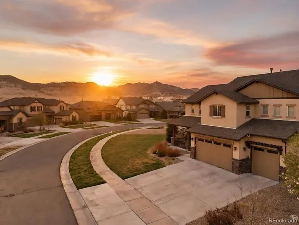 a view of a house with a yard from a terrace