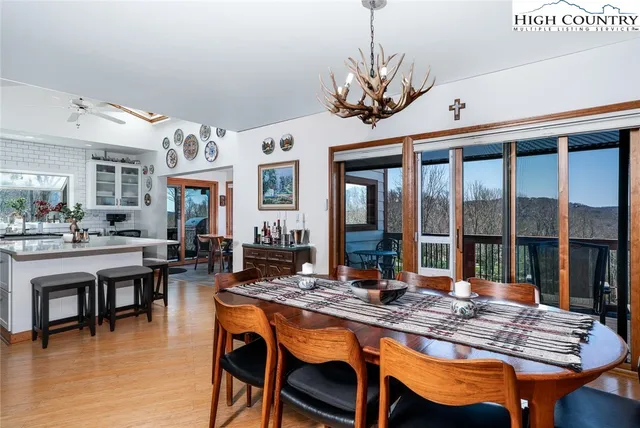 a dinning table and chairs in a living room