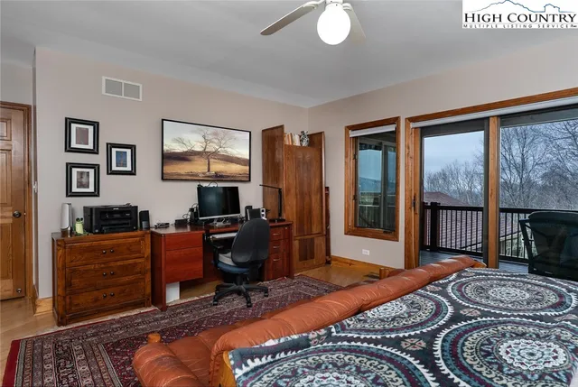 a bedroom with furniture and a window