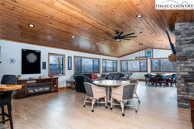 a dinning table and chairs in a room
