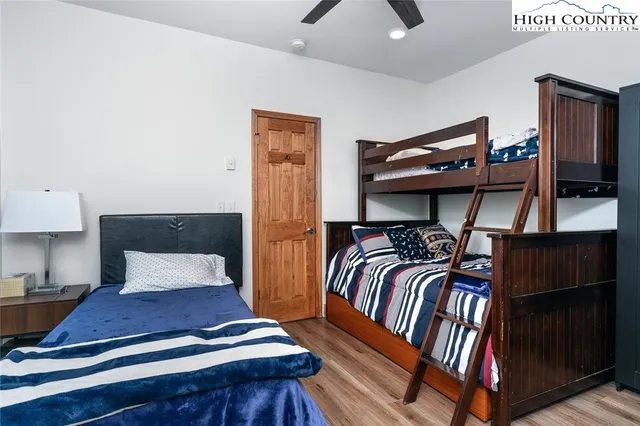 a bedroom with furniture and a night stand