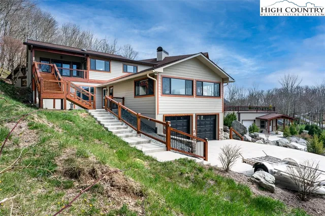 a view of a chairs and table in backyard