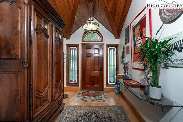 a building with many windows and potted plants