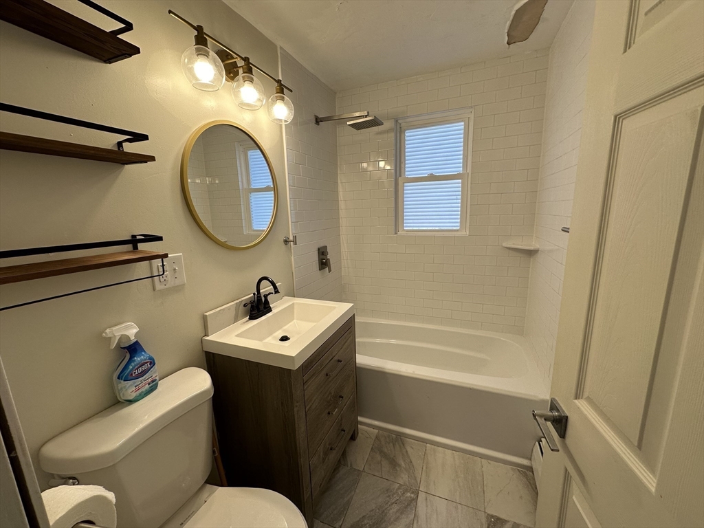 8 Pike Street Hopkinton, MA 01748 - Photo 27 of 34 a bathroom with a sink mirror toilet and a bathtub