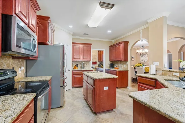 a bedroom with a bed wooden floor and window