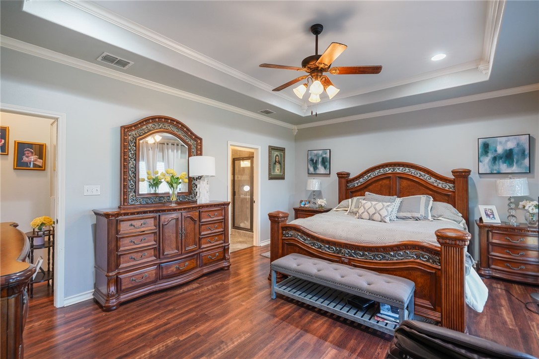 8226 Azimuth Court Corpus Christi, TX 78414 - Photo 13 of 32 a bedroom with a bed and a dresser