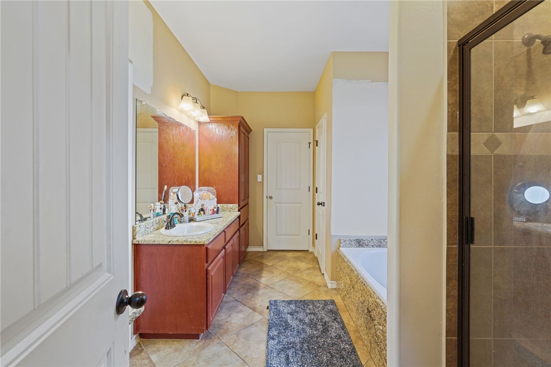 8226 Azimuth Court Corpus Christi, TX 78414 - Photo 14 of 32 a view of a bathroom with shower and mirror