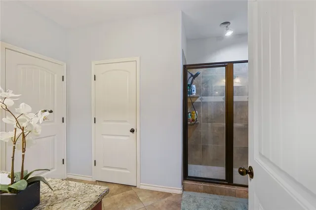 a bathroom with a tub and a window