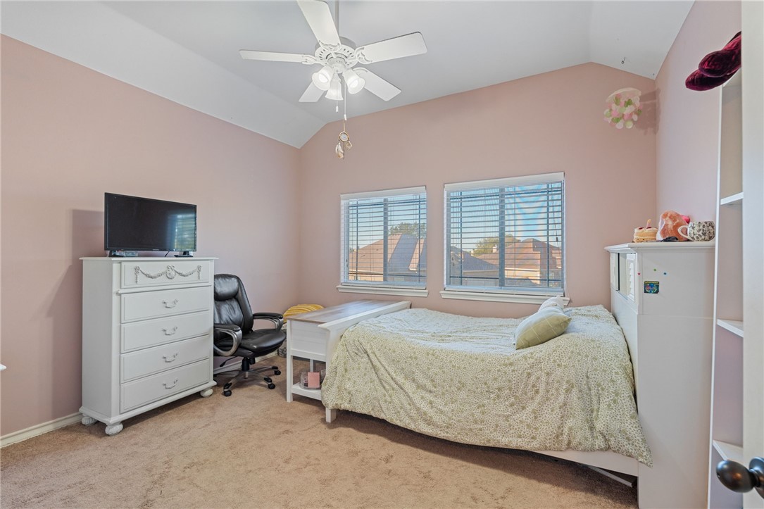 8226 Azimuth Court Corpus Christi, TX 78414 - Photo 20 of 32 a bedroom with a bed and a flat tv screen on dresser
