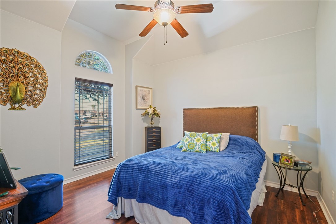 8226 Azimuth Court Corpus Christi, TX 78414 - Photo 23 of 32 a bedroom with a bed and wooden floor
