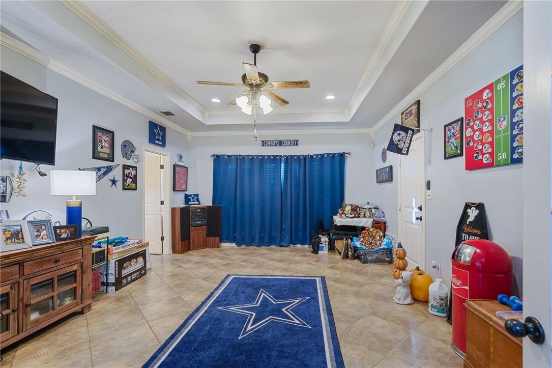 8226 Azimuth Court Corpus Christi, TX 78414 - Photo 24 of 32 a living room with furniture and a flat screen tv