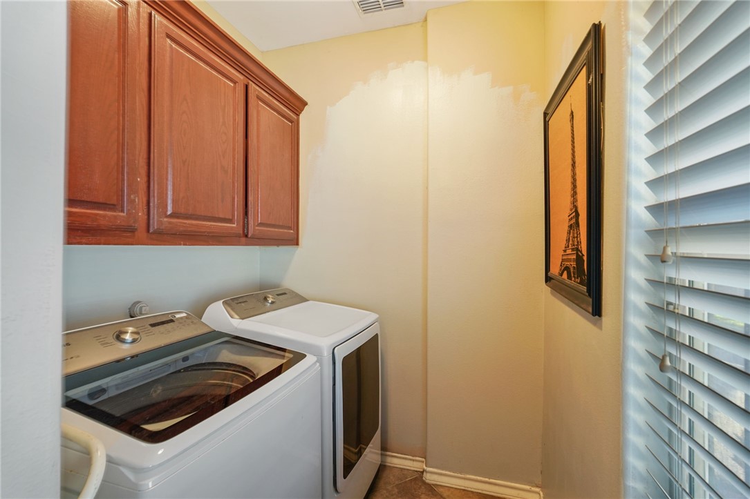 8226 Azimuth Court Corpus Christi, TX 78414 - Photo 26 of 32 a utility room with dryer and washer