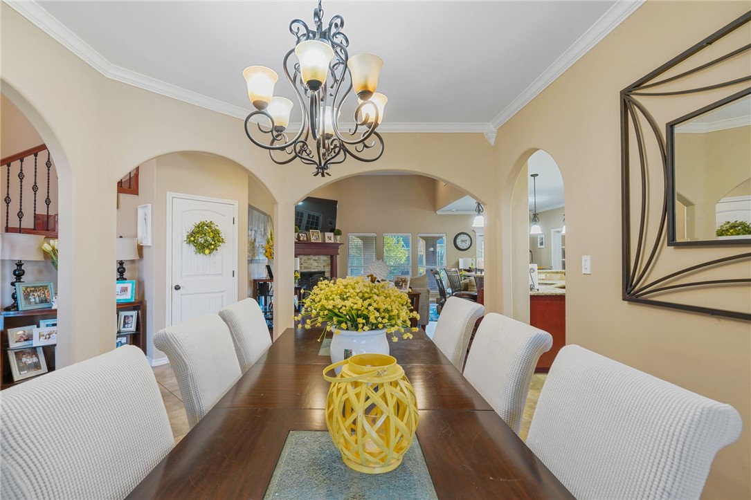 8226 Azimuth Court Corpus Christi, TX 78414 - Photo 5 of 32 a living room with furniture and a chandelier