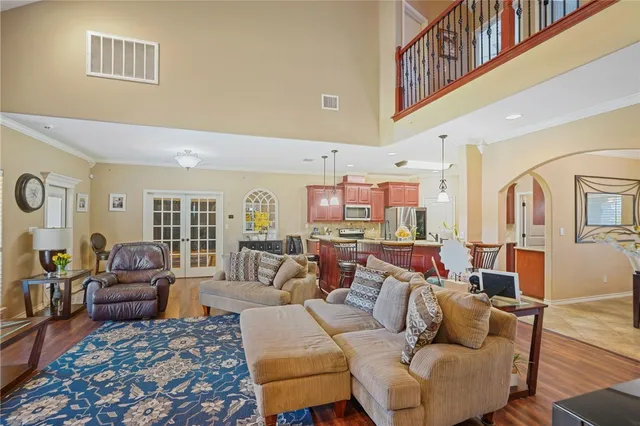 a kitchen with kitchen island granite countertop wooden cabinets stainless steel appliances a sink and a counter top space