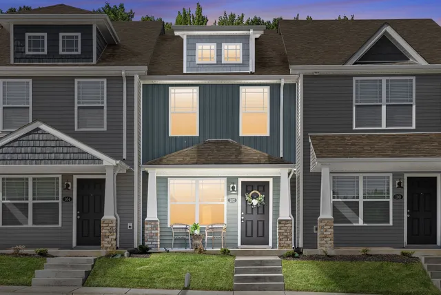 a front view of a house with a yard