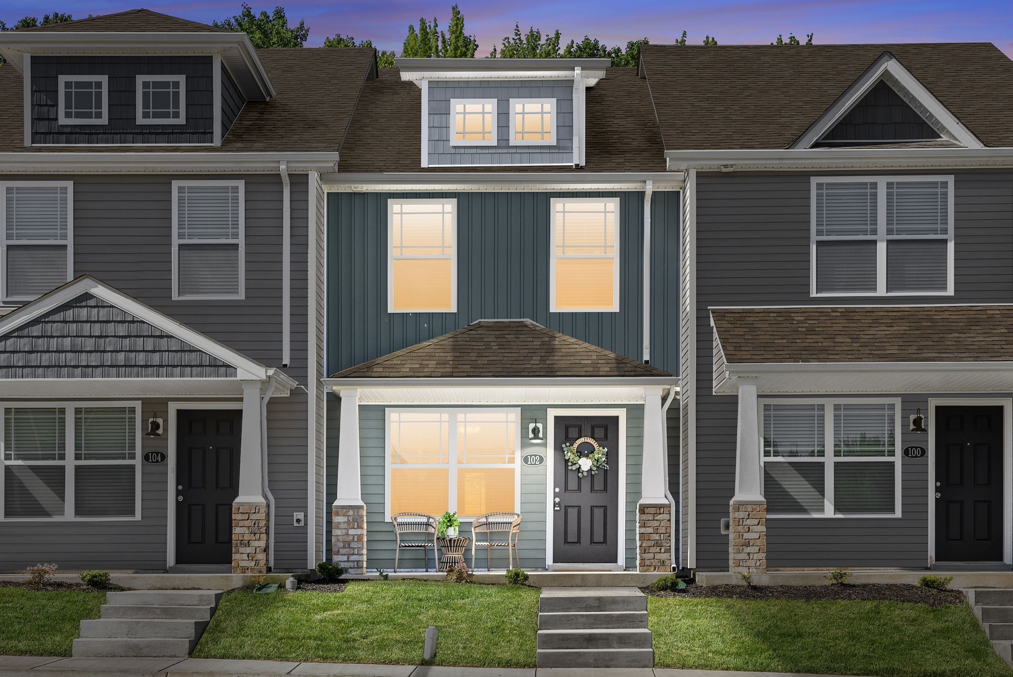 a front view of a house with a yard