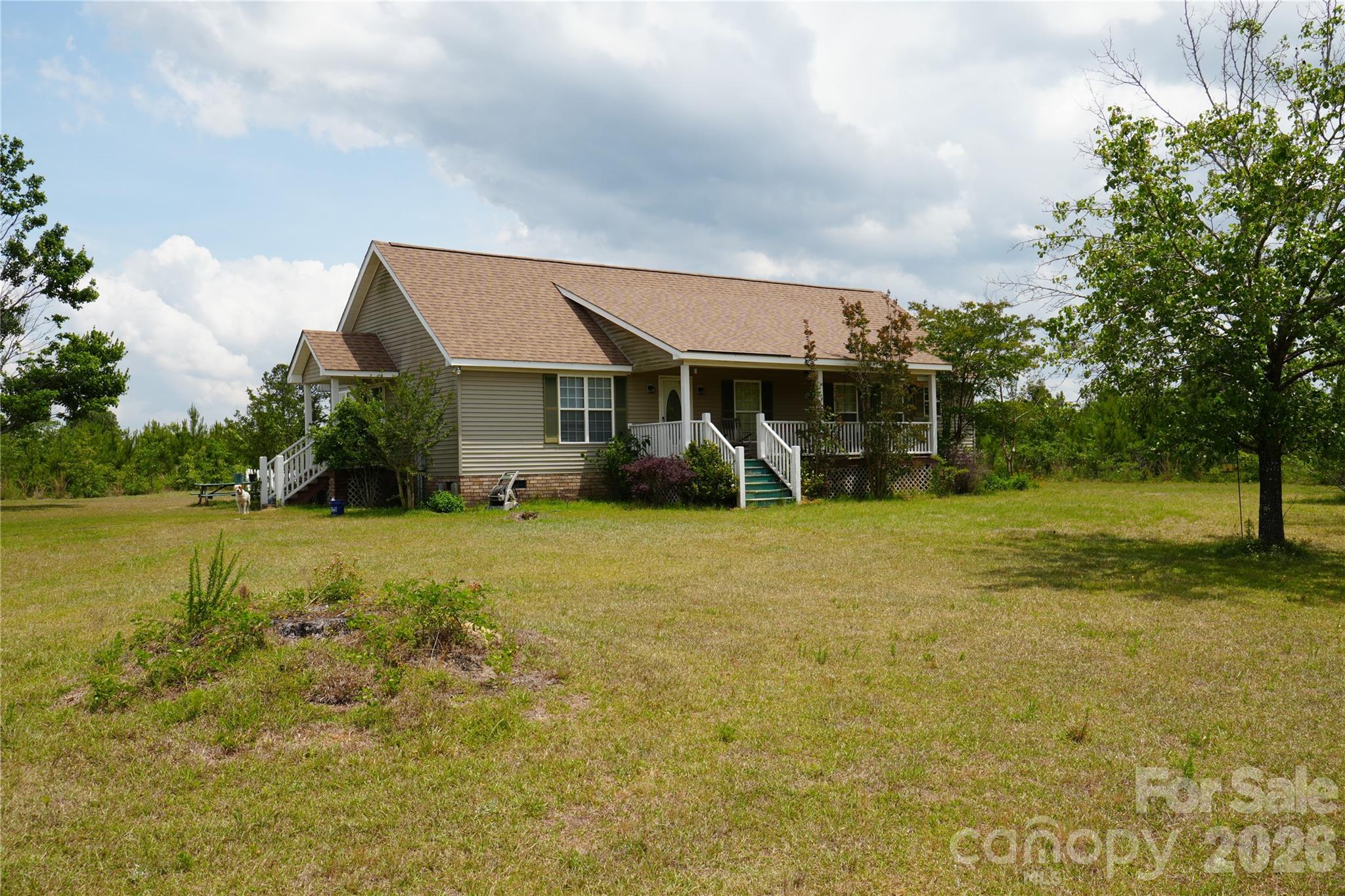 a front view of house with garden