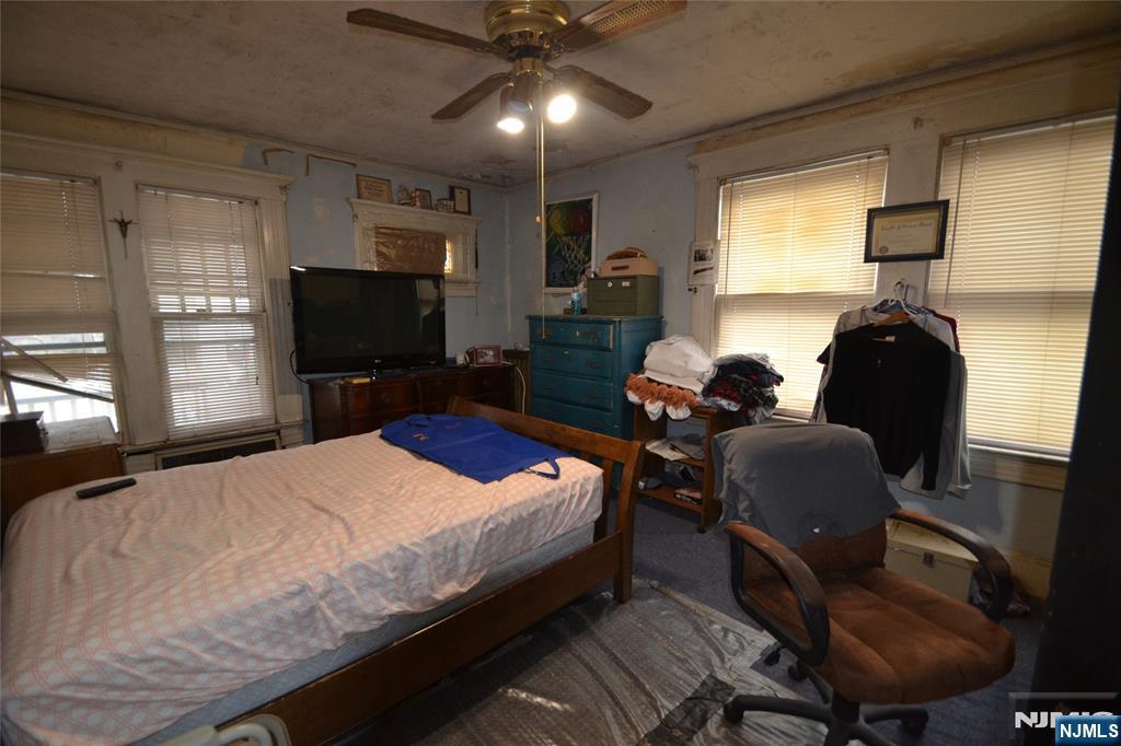 86 Montross Avenue Rutherford, NJ 07070 - Photo 19 of 23 a bedroom with a bed window and a chair