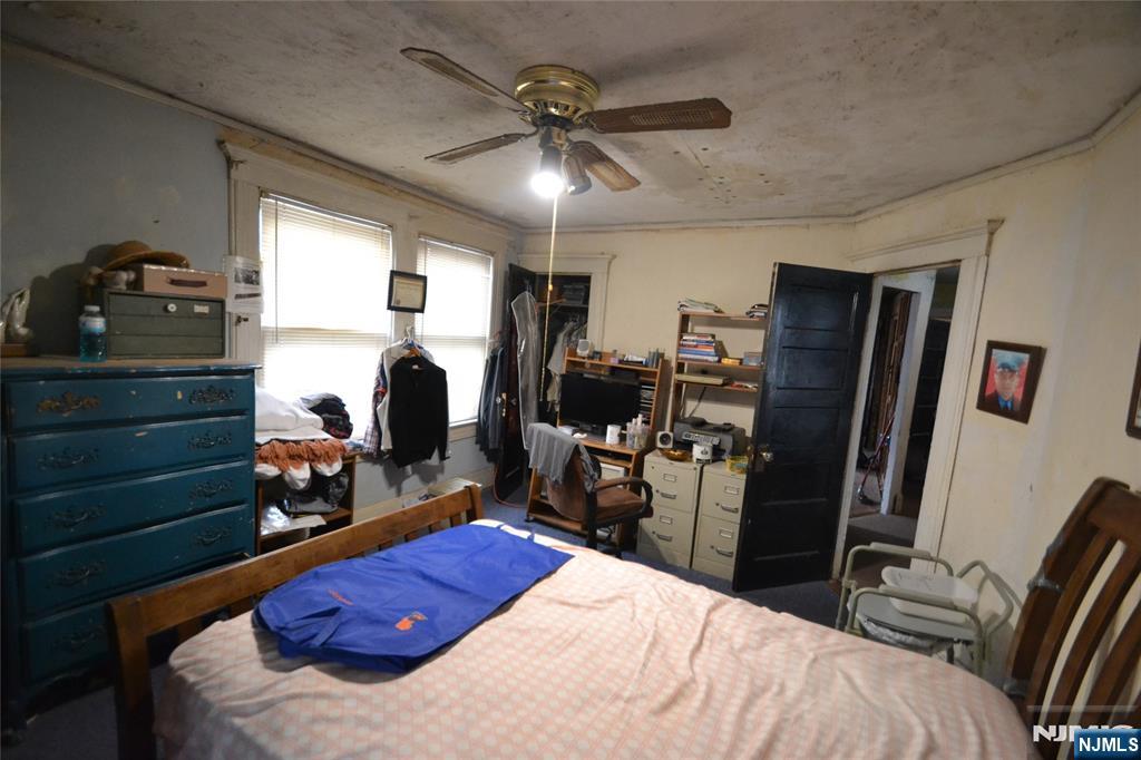 86 Montross Avenue Rutherford, NJ 07070 - Photo 20 of 23 a bed room with a bed and a walk in closet