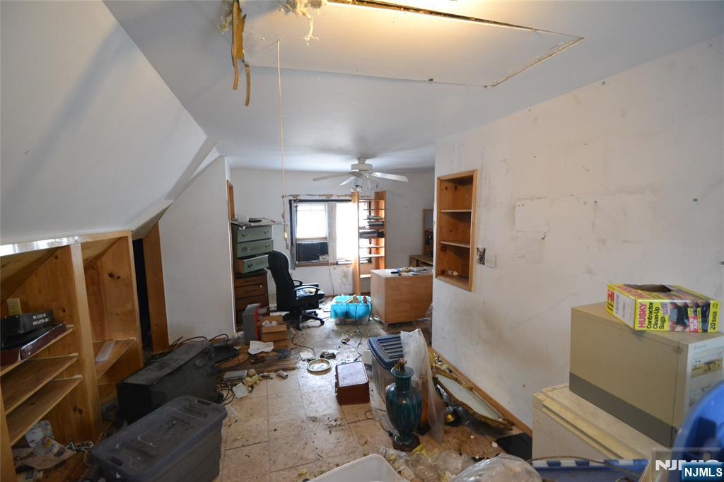 86 Montross Avenue Rutherford, NJ 07070 - Photo 21 of 23 a living room with furniture and a flat screen tv