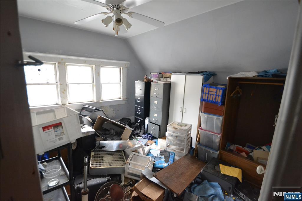 86 Montross Avenue Rutherford, NJ 07070 - Photo 23 of 23 a living room with furniture and a flat screen tv