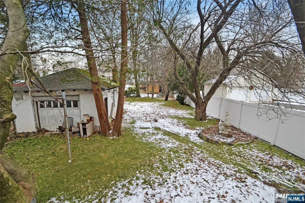 86 Montross Avenue Rutherford, NJ 07070 - Photo 3 of 23 a tree in front of a white house