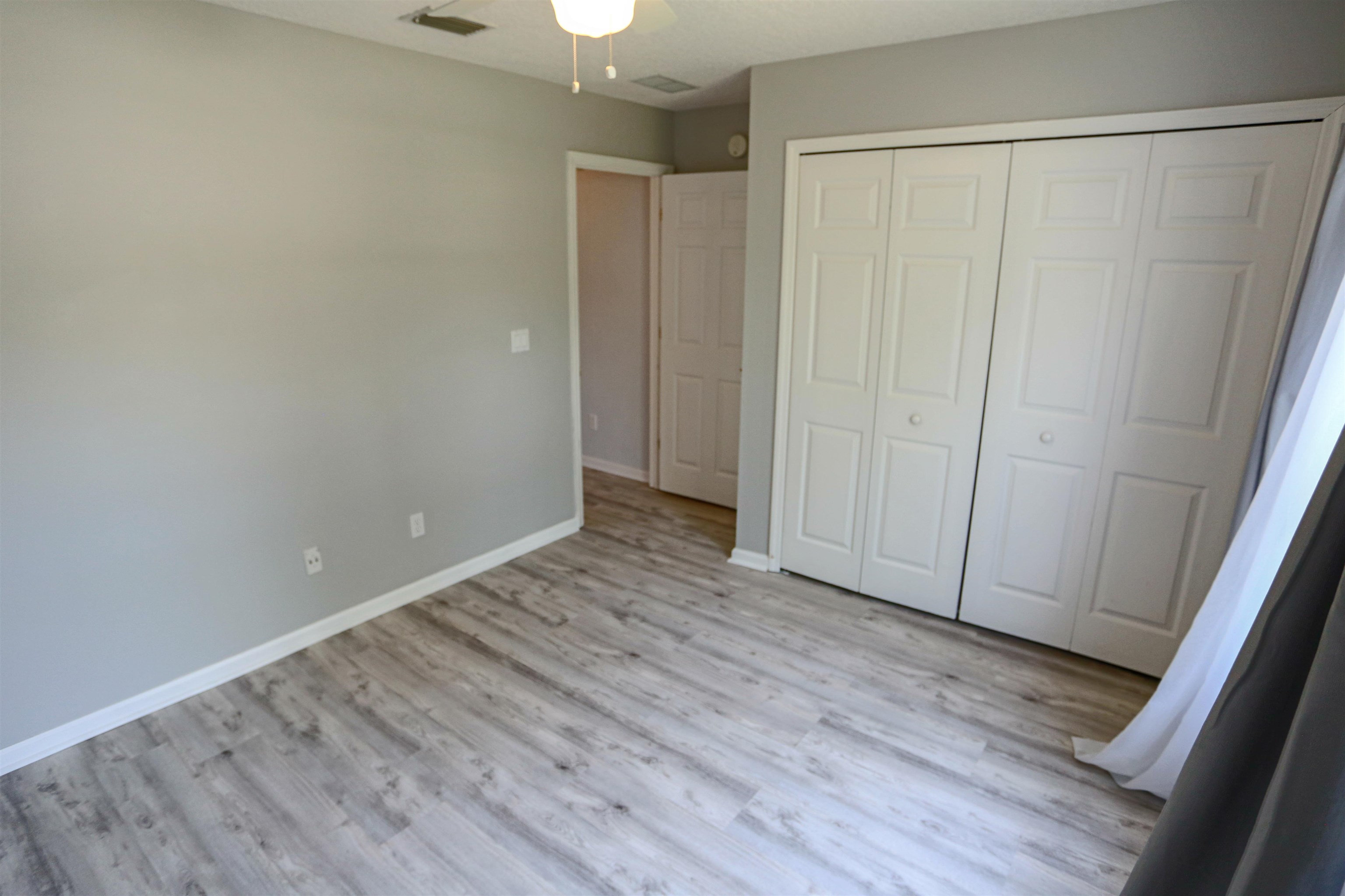 1768 Keswick Road St. Augustine, FL 32084 - Photo 20 of 30 a view of an empty room with wooden floor