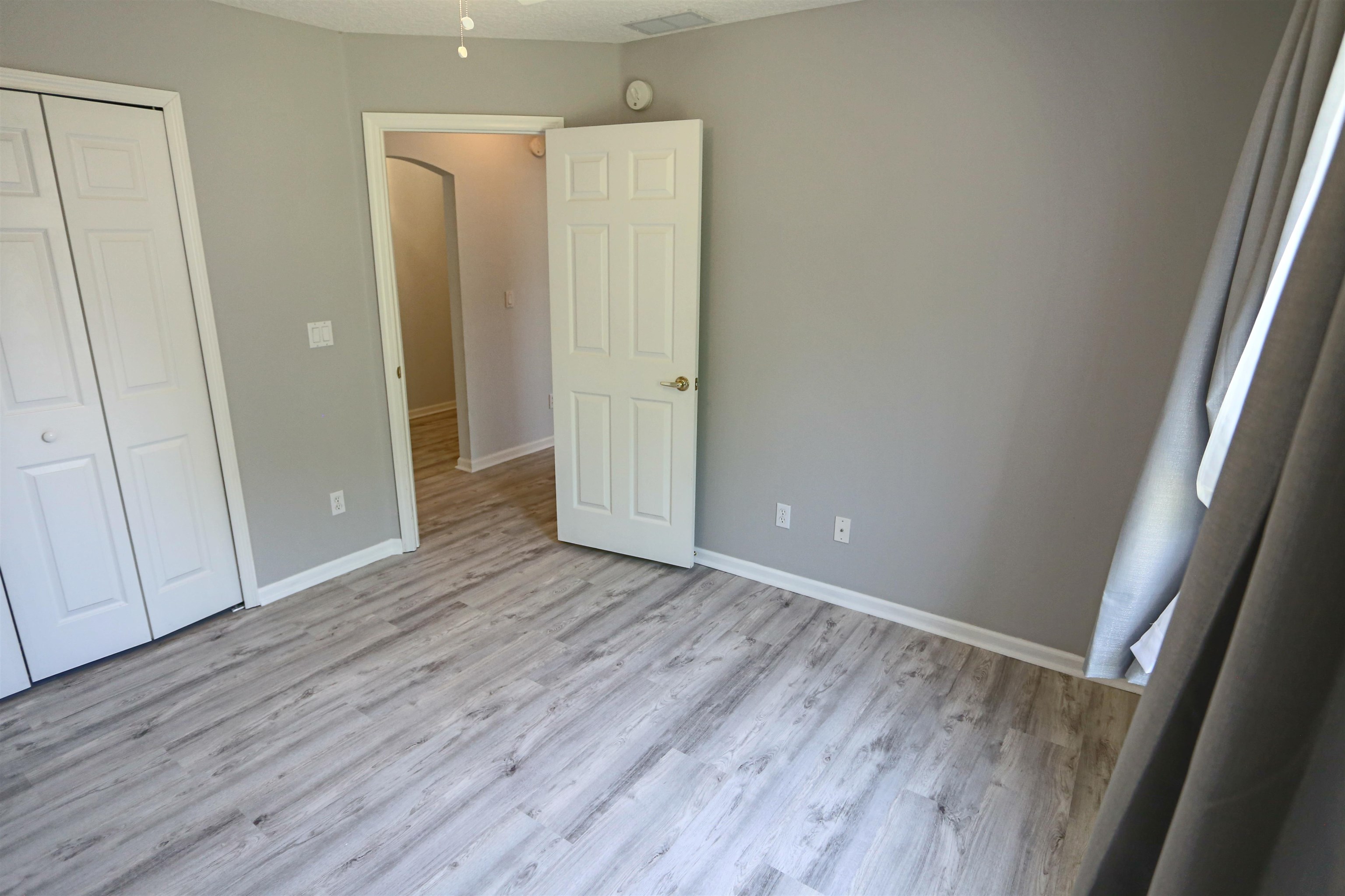 1768 Keswick Road St. Augustine, FL 32084 - Photo 24 of 30 a view of an empty room with wooden floor