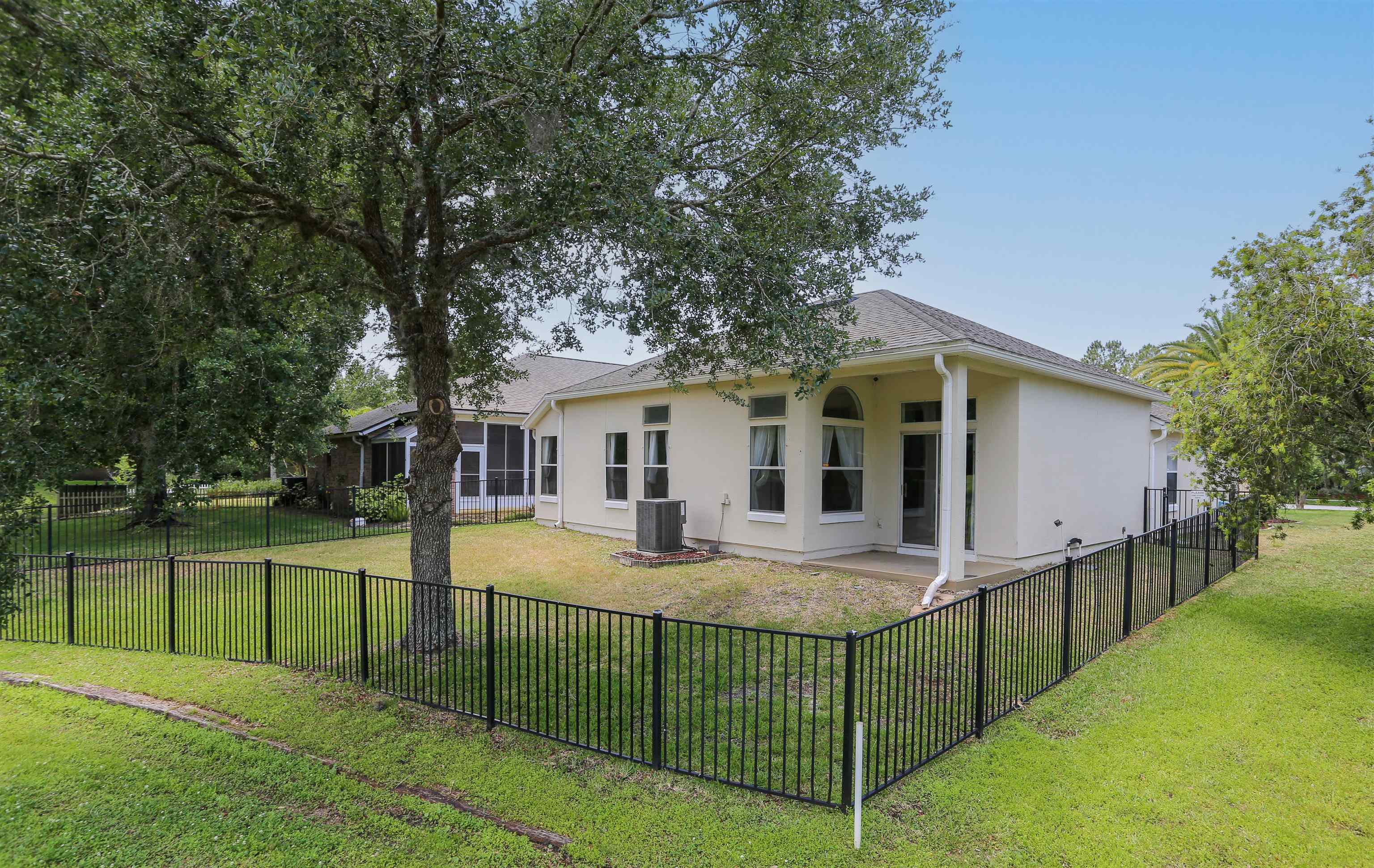 1768 Keswick Road St. Augustine, FL 32084 - Photo 29 of 30 a view of a house with backyard and tree