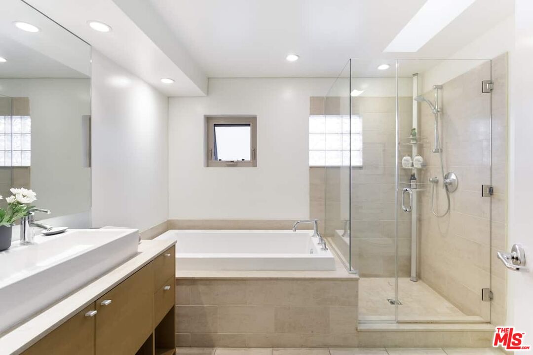 530 North Larchmont Boulevard, Unit 4 Los Angeles, CA 90004 - Photo 11 of 18 a bathroom with a bathtub and a sink