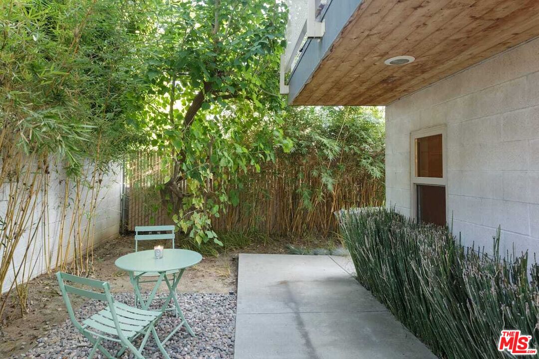 530 North Larchmont Boulevard, Unit 4 Los Angeles, CA 90004 - Photo 18 of 18 a view of a backyard with plants and a fountain