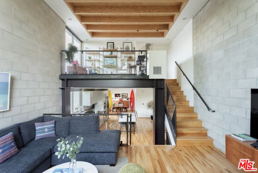 530 North Larchmont Boulevard, Unit 4 Los Angeles, CA 90004 - Photo 2 of 18 a living room with furniture and a wooden floor