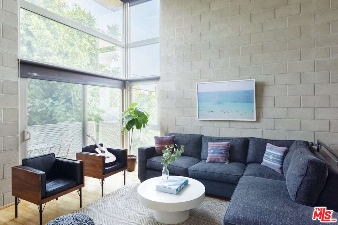 530 North Larchmont Boulevard, Unit 4 Los Angeles, CA 90004 - Photo 3 of 18 a living room with furniture and a large window