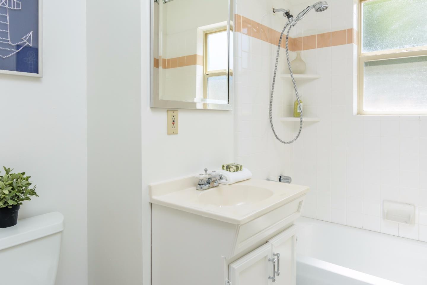 416 Cullen Road Pacifica, CA 94044 - Photo 12 of 18 a bathroom with a sink a vanity and a mirror