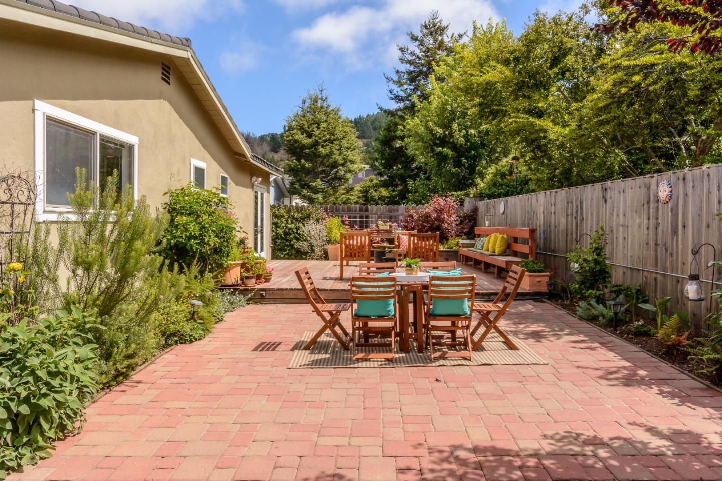 416 Cullen Road Pacifica, CA 94044 - Photo 16 of 18 a view of backyard with outdoor seating a patio and plants