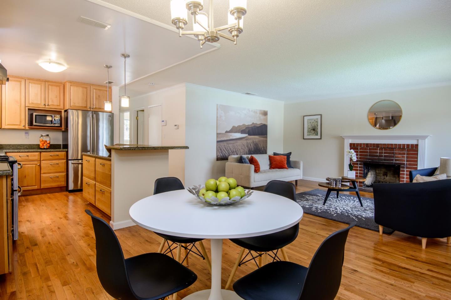 416 Cullen Road Pacifica, CA 94044 - Photo 3 of 18 a living room with furniture and a fireplace