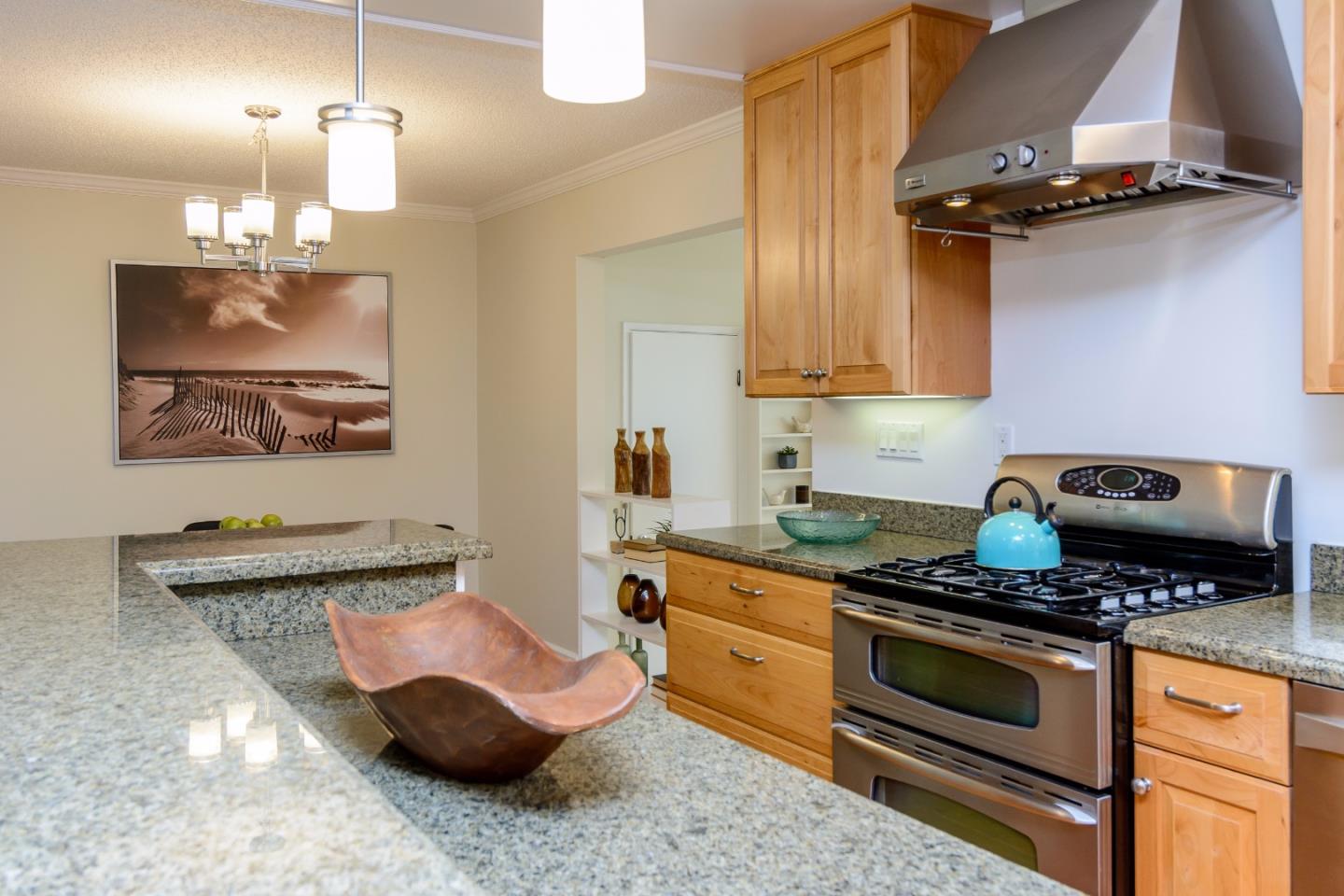 416 Cullen Road Pacifica, CA 94044 - Photo 5 of 18 a kitchen with a sink and a stove top oven