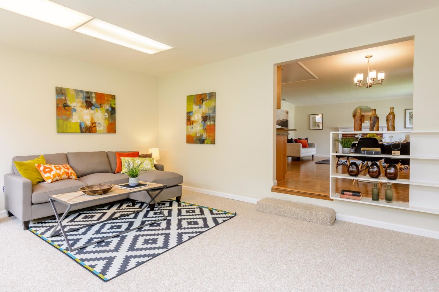 416 Cullen Road Pacifica, CA 94044 - Photo 8 of 18 a living room with furniture a flat screen tv and a table