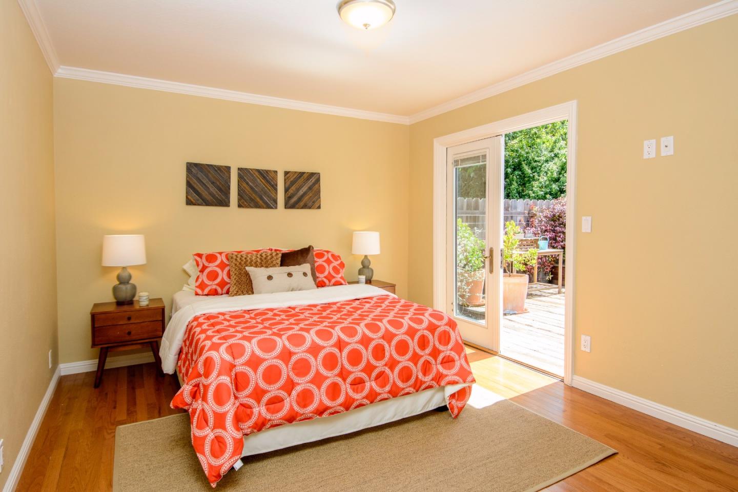 416 Cullen Road Pacifica, CA 94044 - Photo 9 of 18 a bedroom with a bed and wooden floor