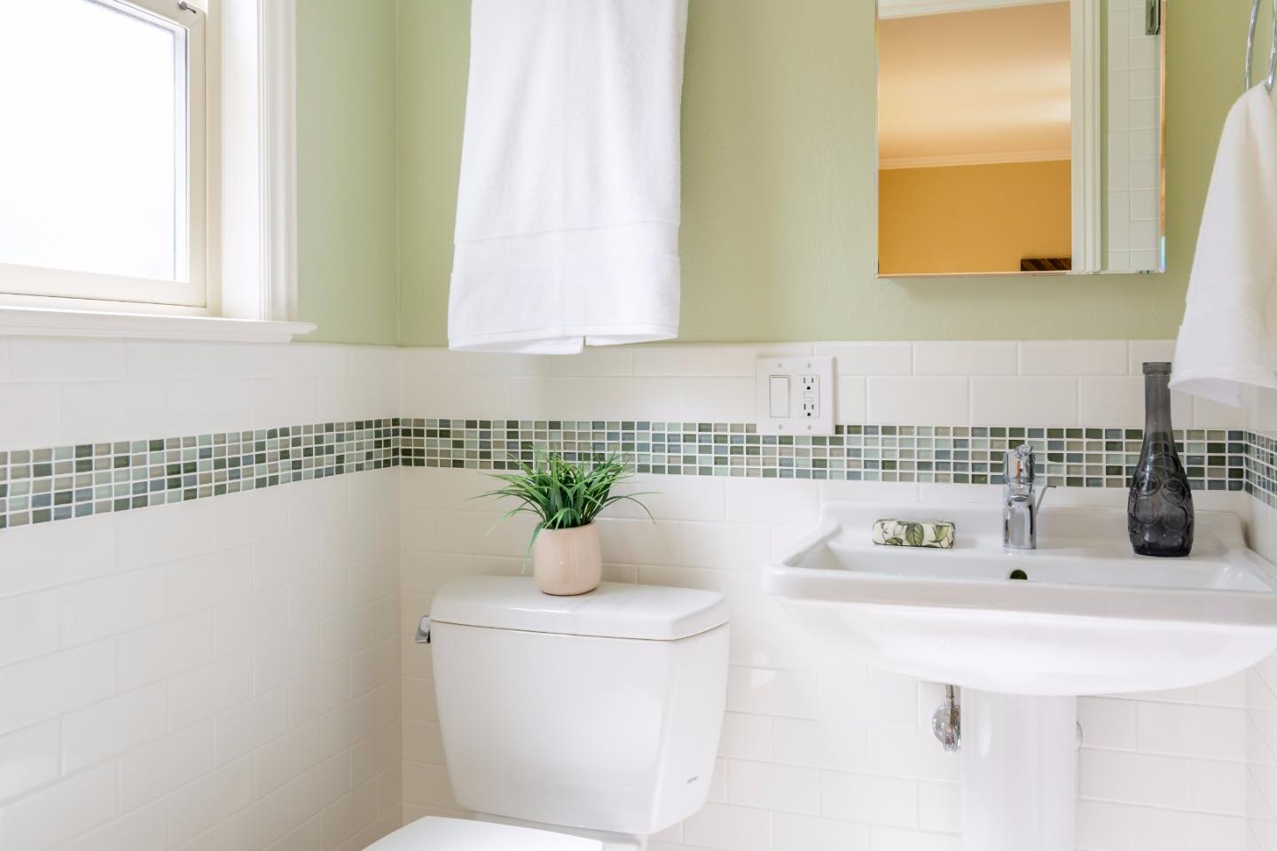 416 Cullen Road Pacifica, CA 94044 - Photo 10 of 18 a bathroom with a sink and a mirror