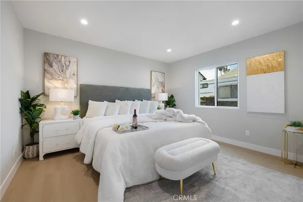 a bedroom with bed and a window