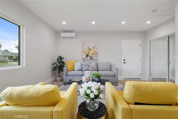 a living room with furniture and a window
