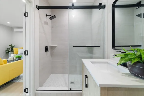 a bathroom with a shower and a bath tub