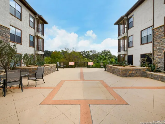 a view of a building with sitting area