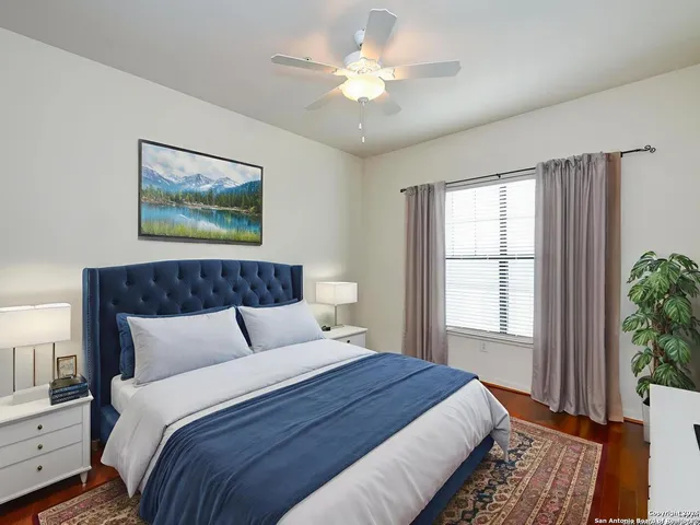 a bedroom with bed and window